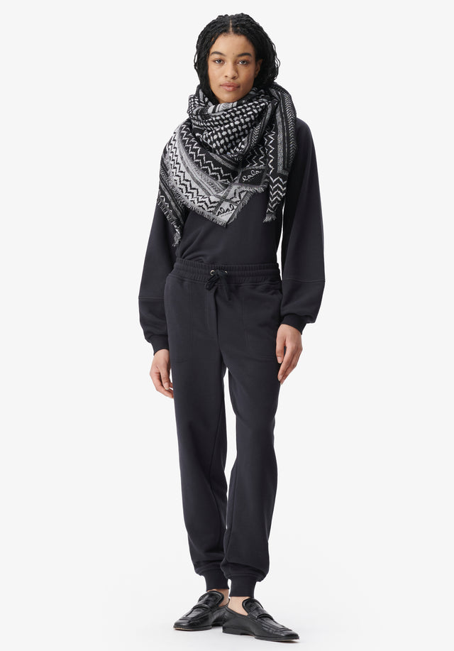 Scarf Anais zebra swirl black - Anais is a large cube adorned with an intricately crafted...
